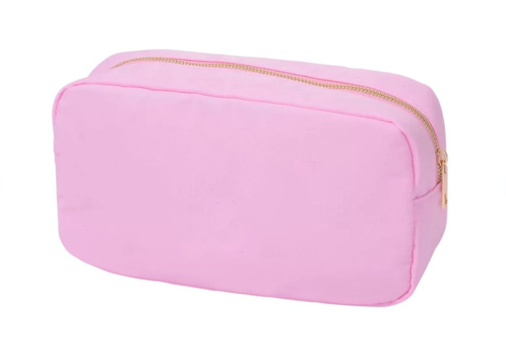 blank pink cosmetic bag on white stock photo background