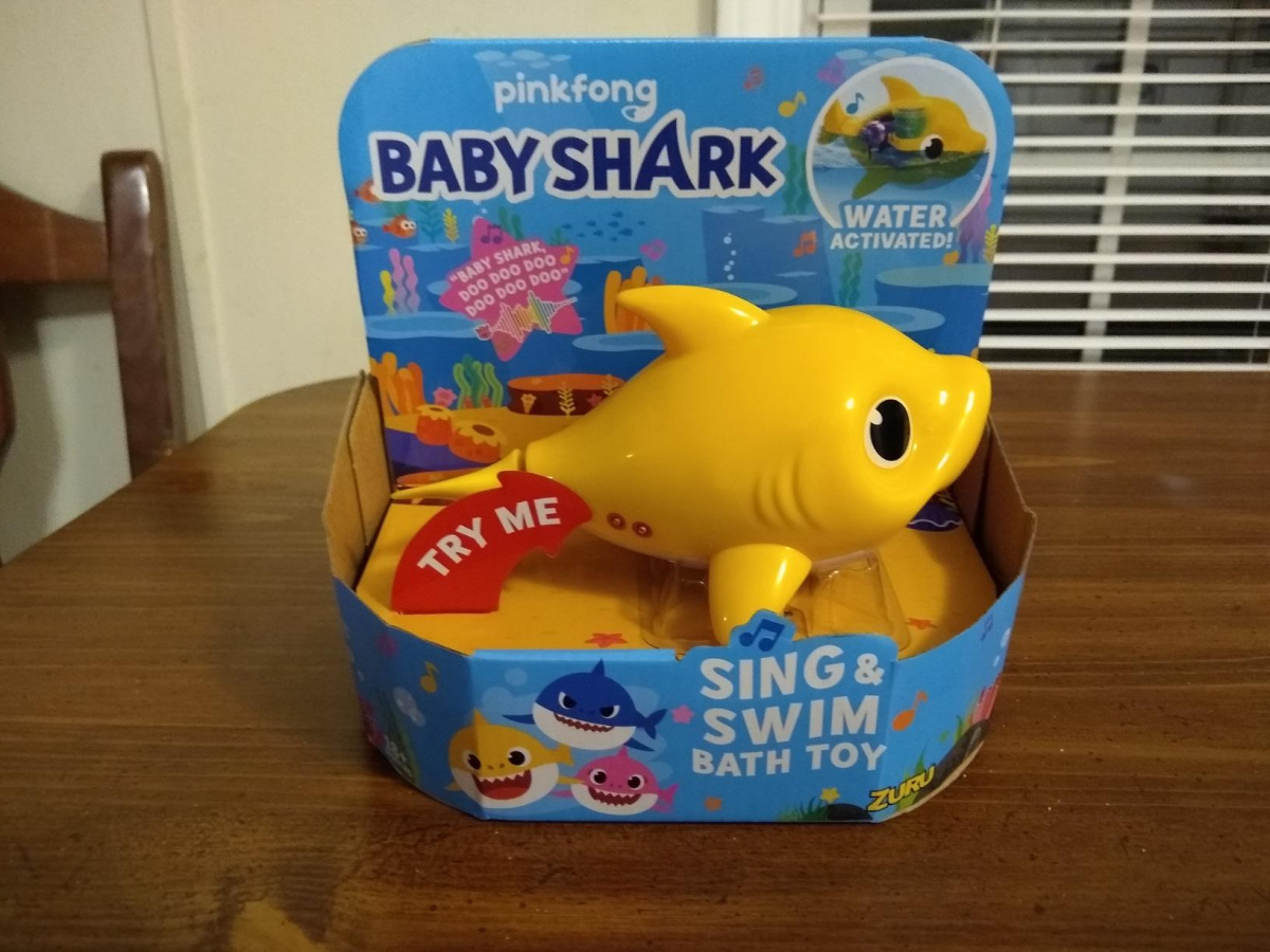 baby shark sing and swim bath toy in packaging on a table