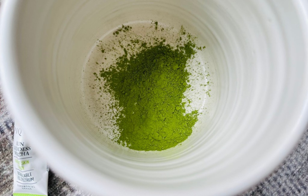 green matcha in bottom of empty cup