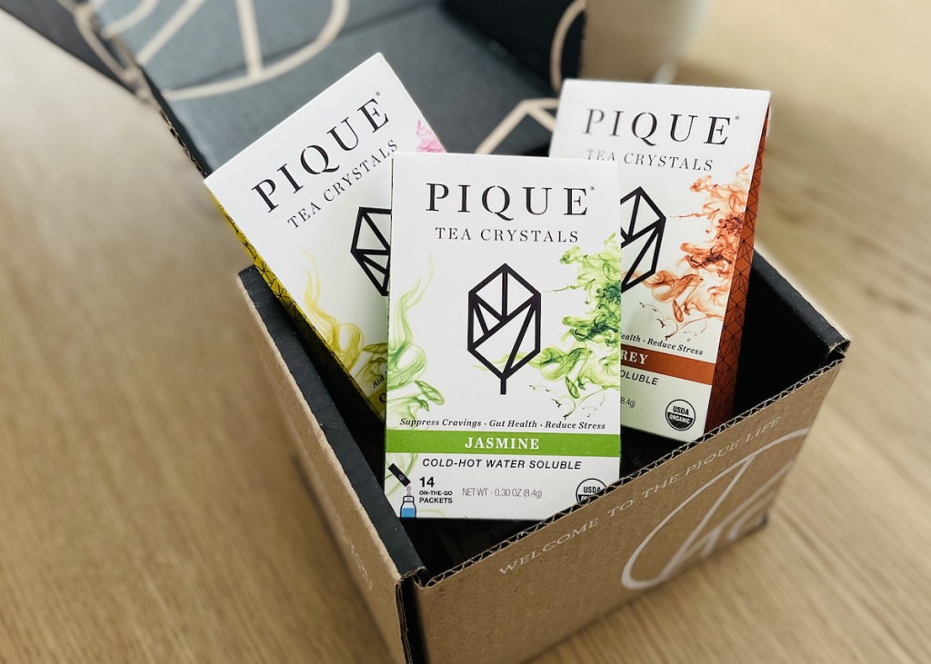 box of pique tea boxes on wood table