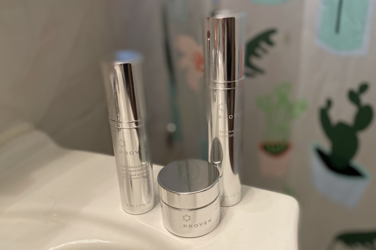 3 skincare products near sink