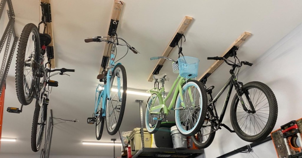 4 bikes hanging from garage ceiling