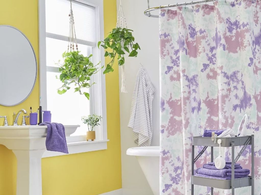 bathroom with pink and purple tie dye shower curtain