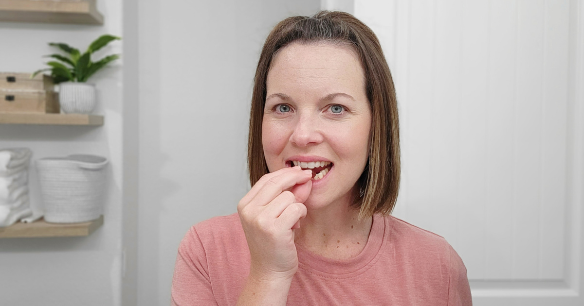 woman eating sleep gummies