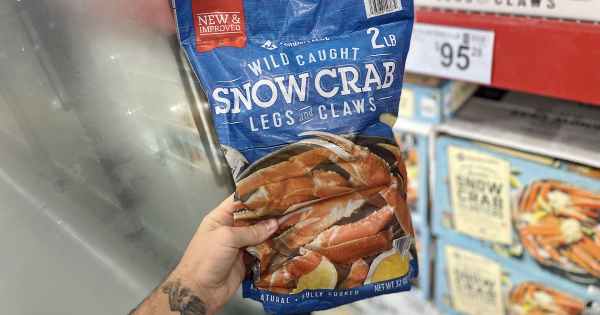 hand holding snow crabs bag