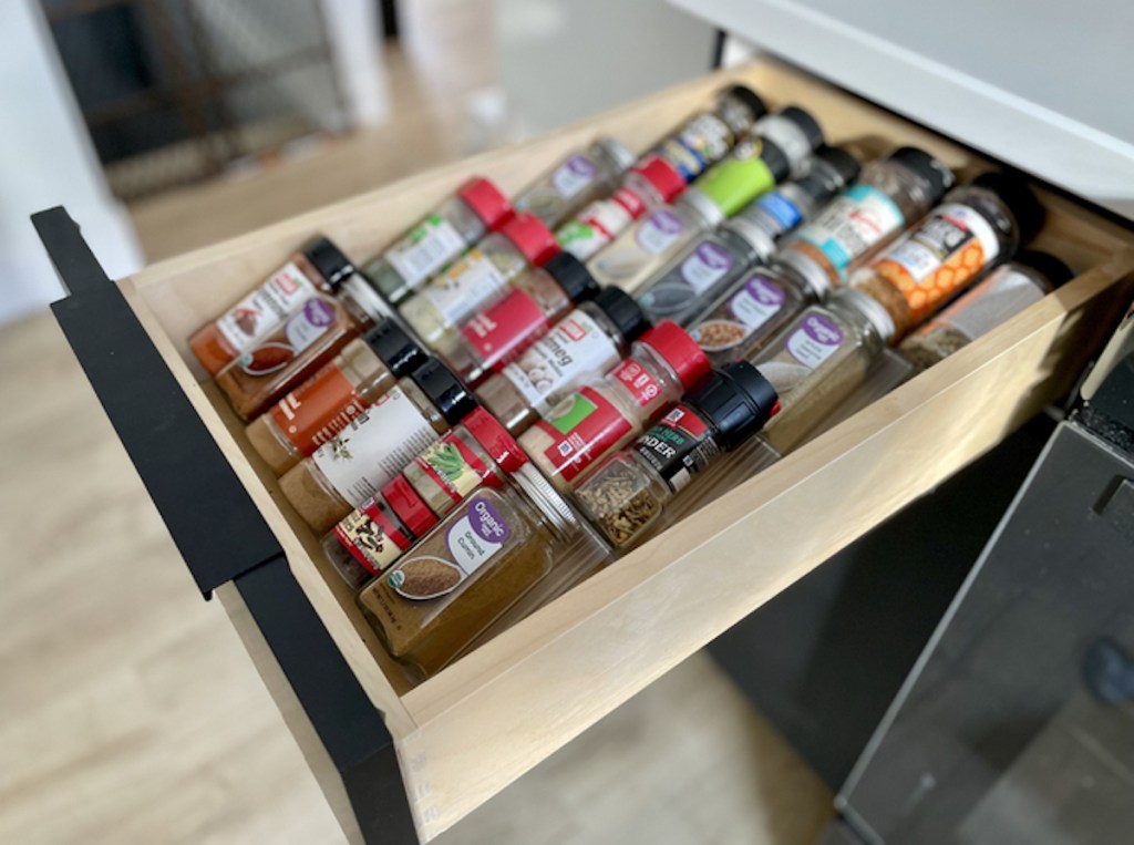 drawer with spice rack organizer and spices inside