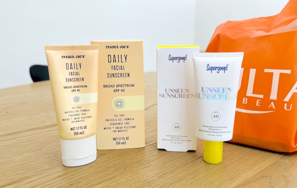 supergoop unseen sunscreen and trader joes daily facial sunscreen dupe on wood table