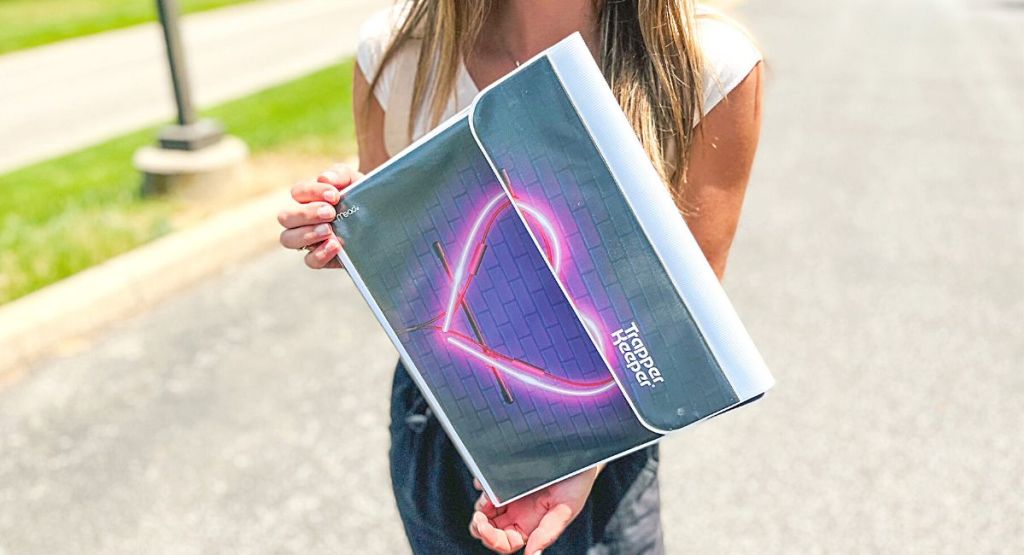 woman holding heart Trapper Keeper