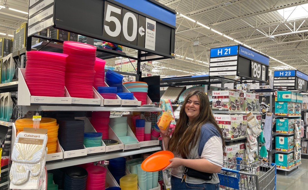 woman standing with 50 cent dishes in walmart