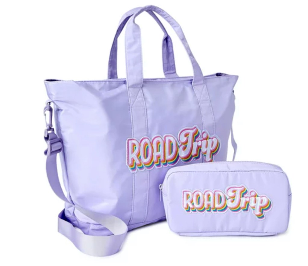 purple tote bags with rainbow roadtrip patches on them