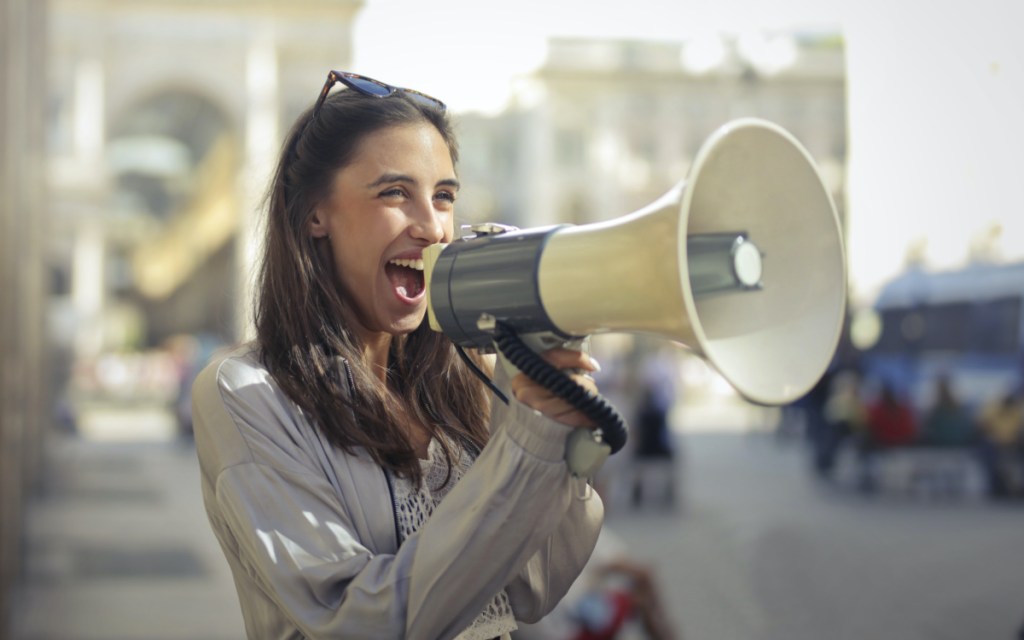 woman shouting in mega phone