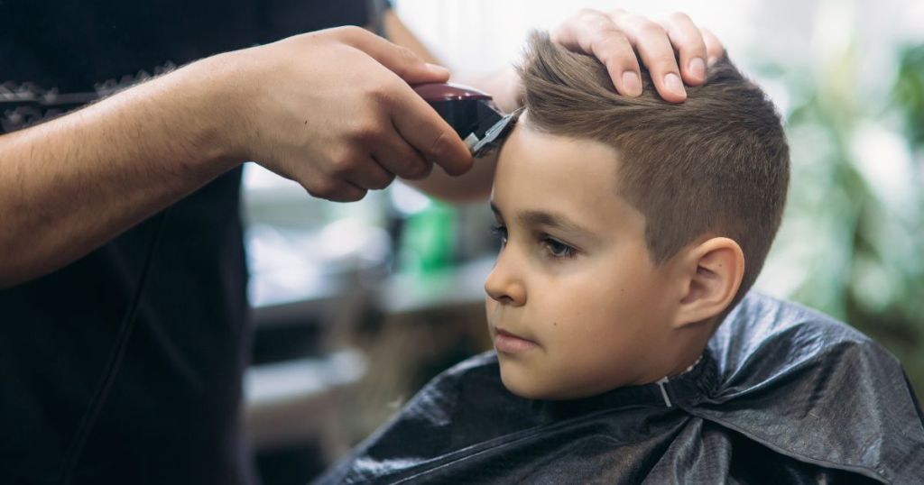 Little boy getting a haircut
