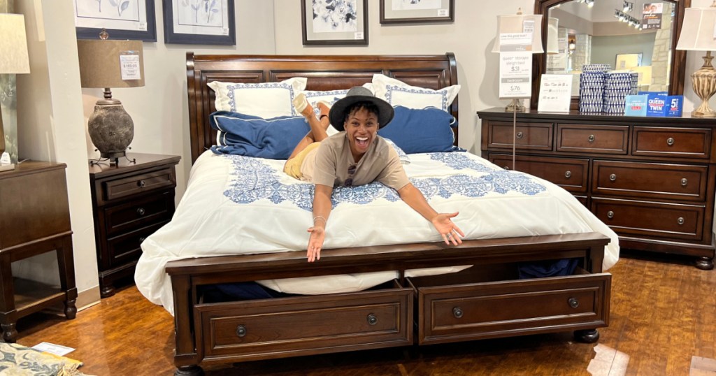 Woman on the Porter Storage Bed from Ashley Furniture