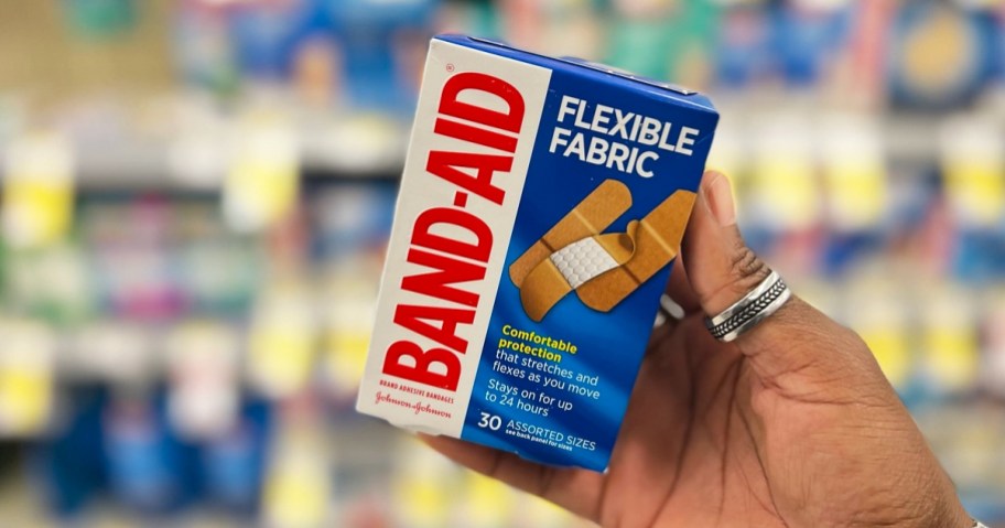 hand holding box of band aids