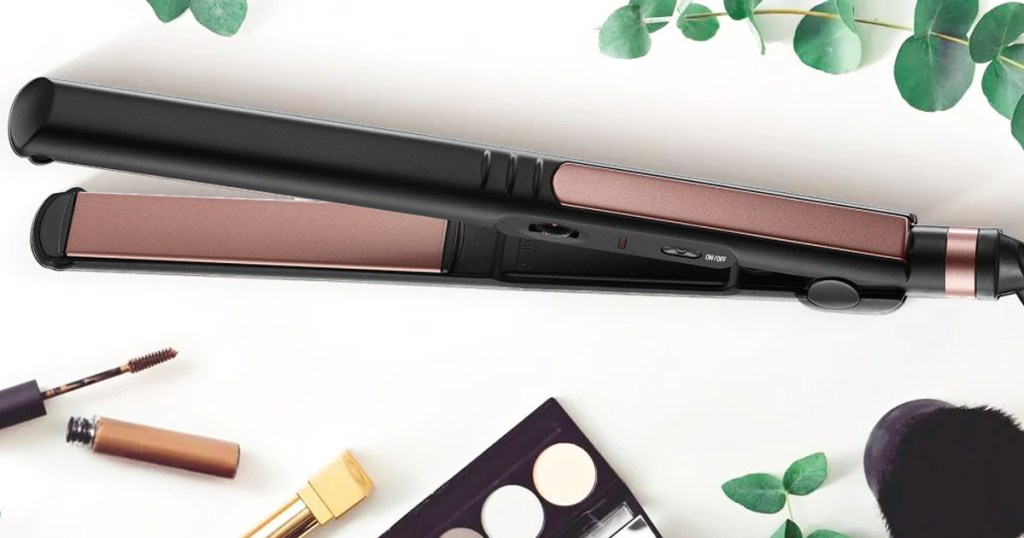 black and rose gold Conair Flat Iron with makeup products