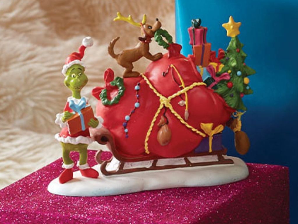 Department 56 Grinch Village figurine of the Grinch with his packed sleigh