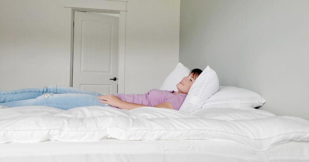 person laying down on ELEMUSE Extra Thick Cooling Mattress Topper
