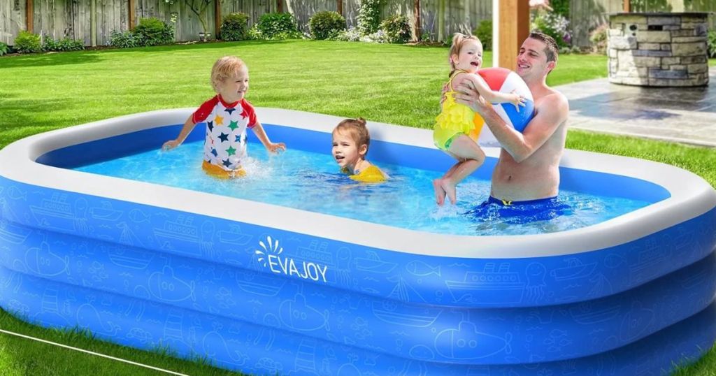 3 kids and adult man in inflatable pool outside