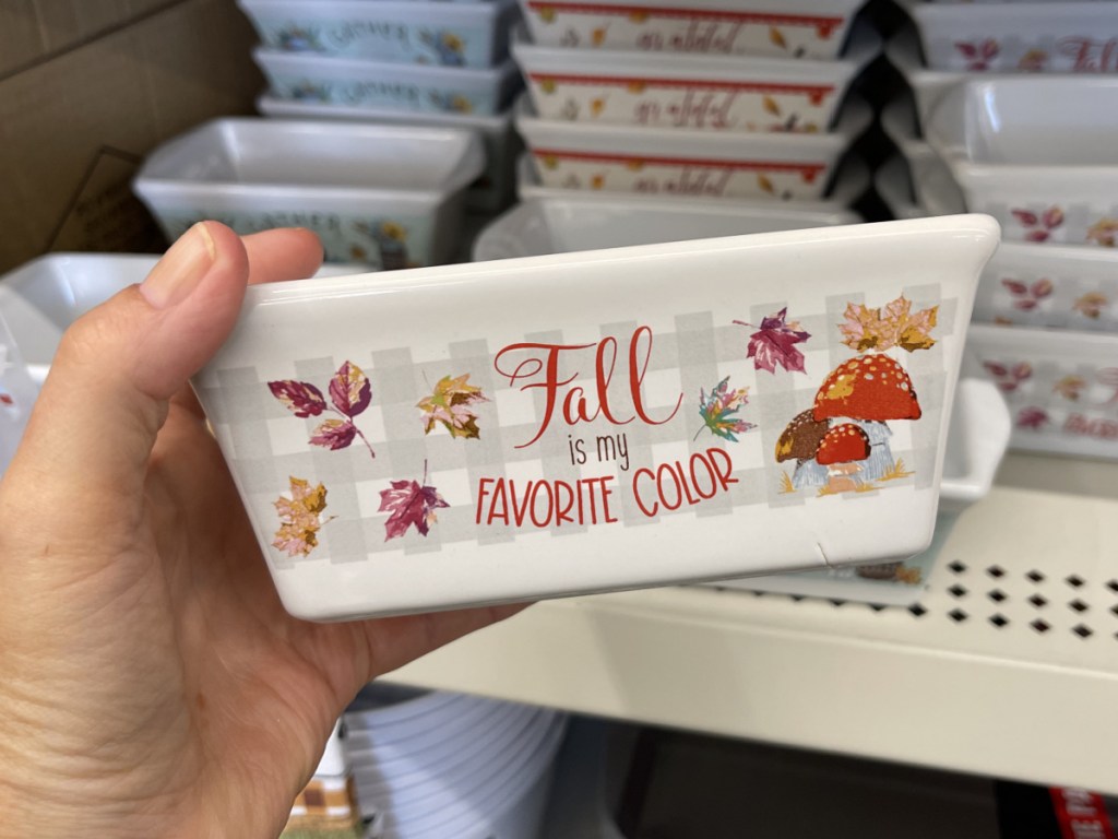 hand holding fall-themed loaf pan in store