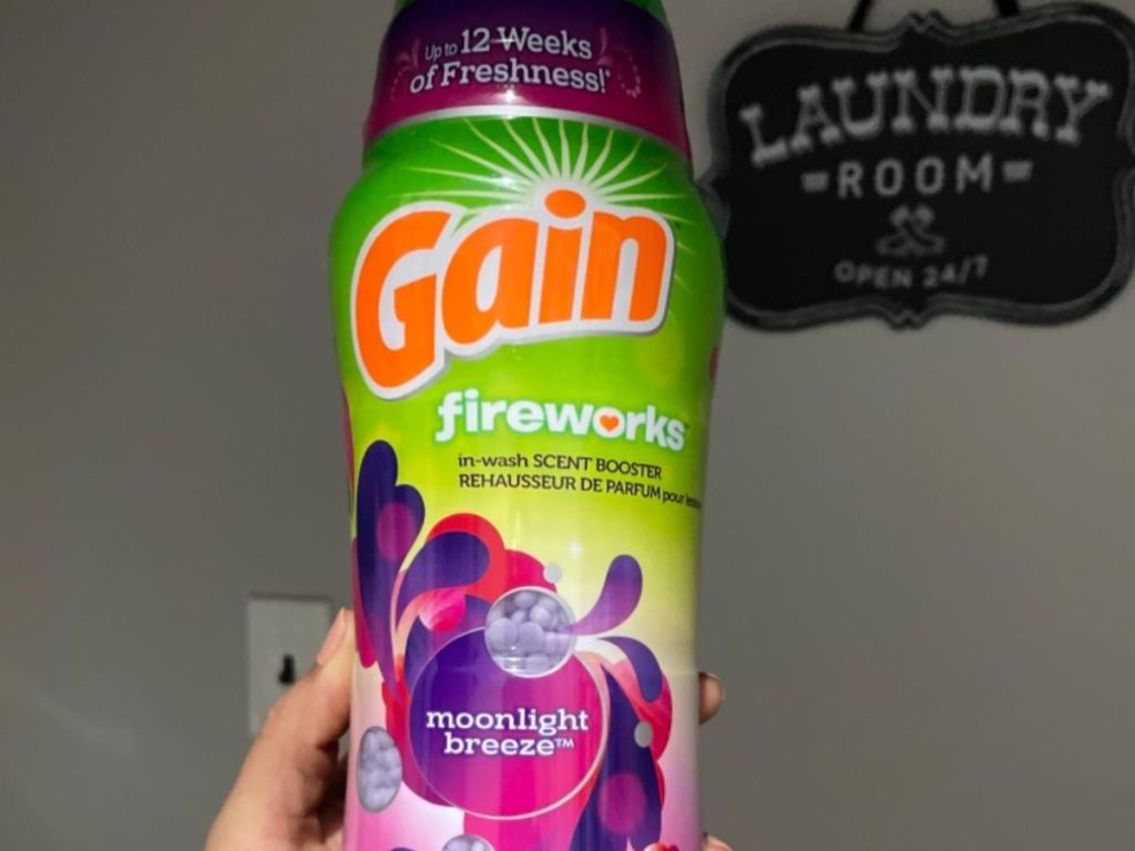 hand holding a bottle of Gain Fireworks
