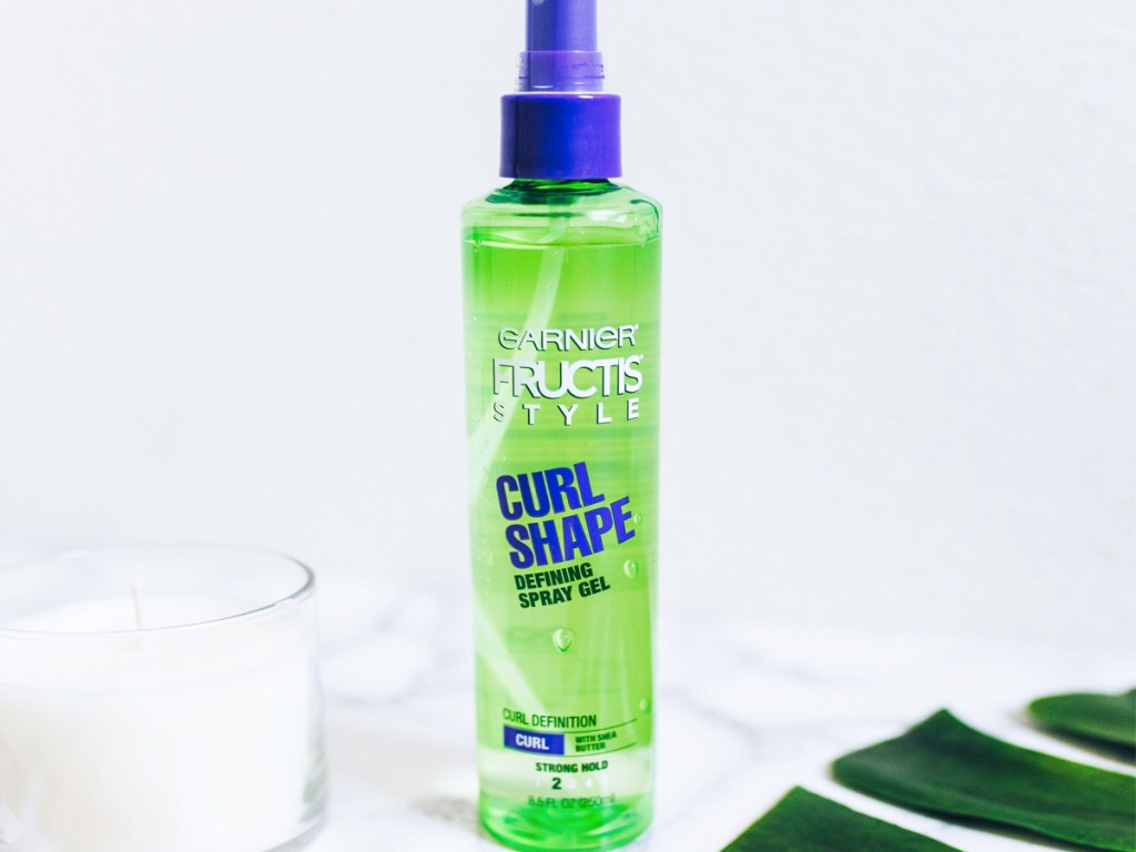 green and purple bottle of garnier curl defining spray