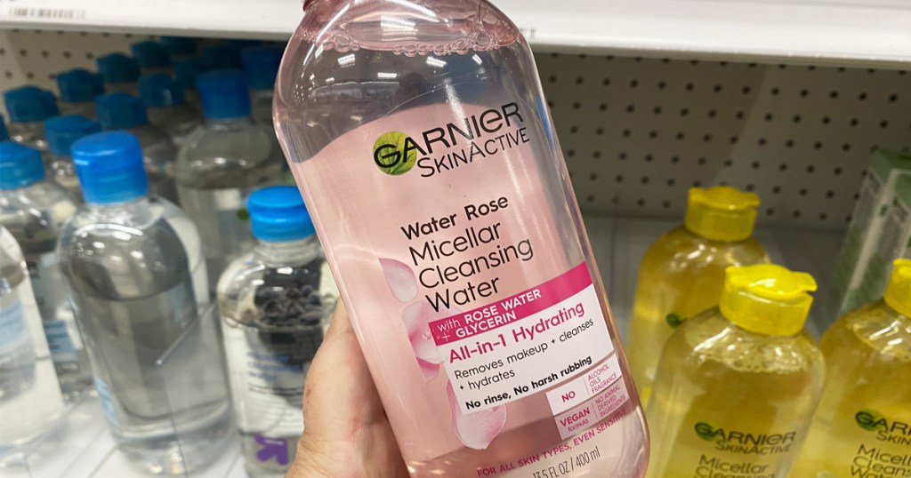 holding bottle of Garnier SkinActive Micellar Water