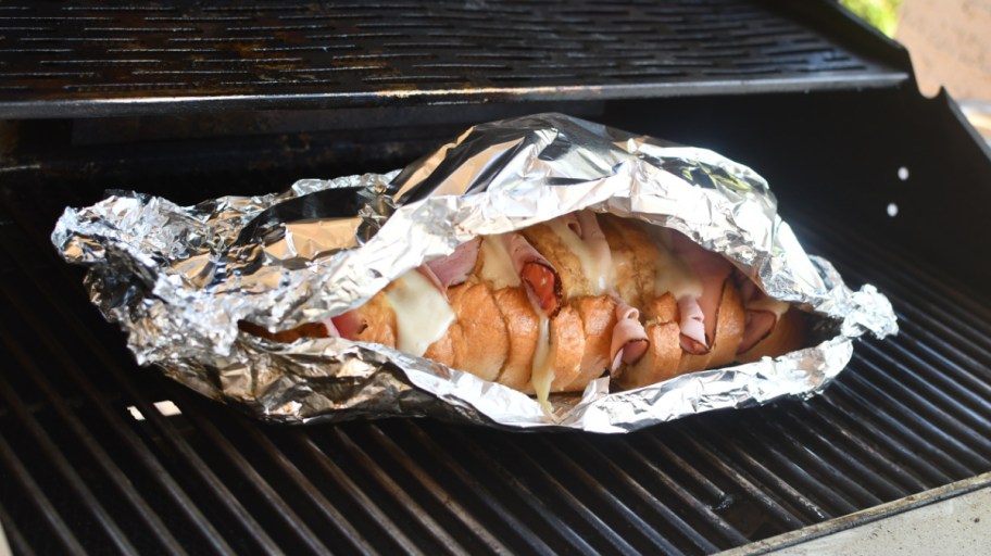 Grilled Ham and Cheese Pull Apart sandwiches on the grill, one of our favorite camping food ideas and tailgating recipes