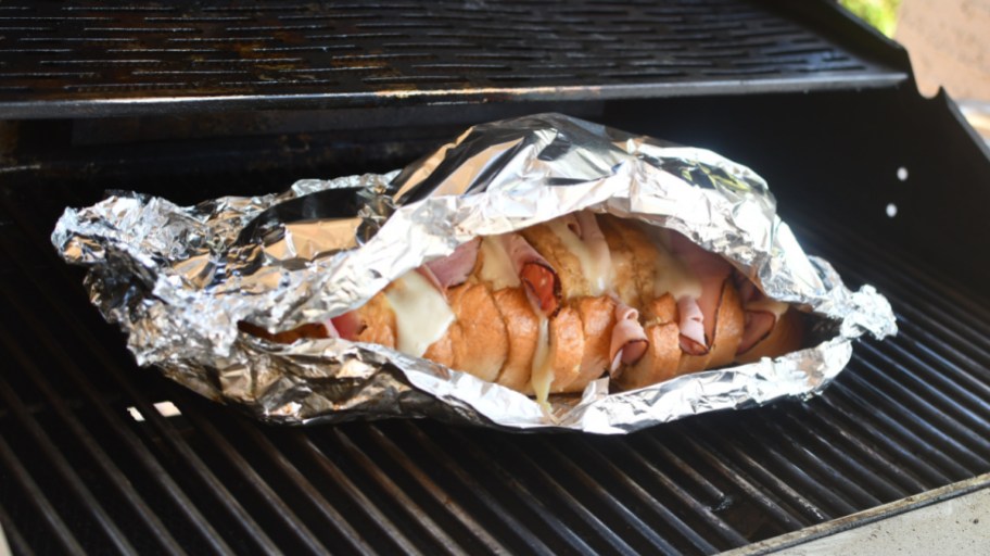 Grilled Ham and Cheese Pull Apart sandwiches on the grill, one of our favorite camping food ideas and tailgating recipes