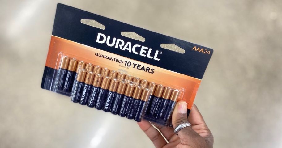 Duracell AAA Batteries 24 Pack in a woman's hand