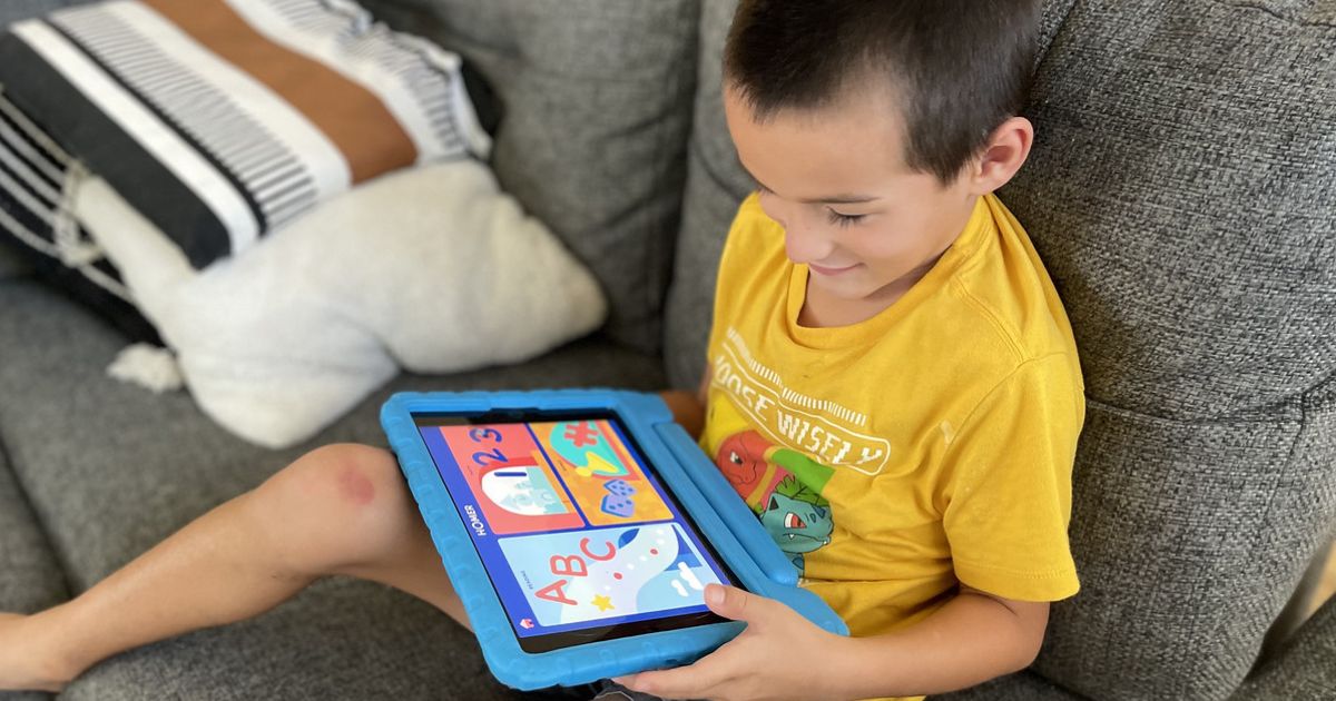 Boy playing on Tablet