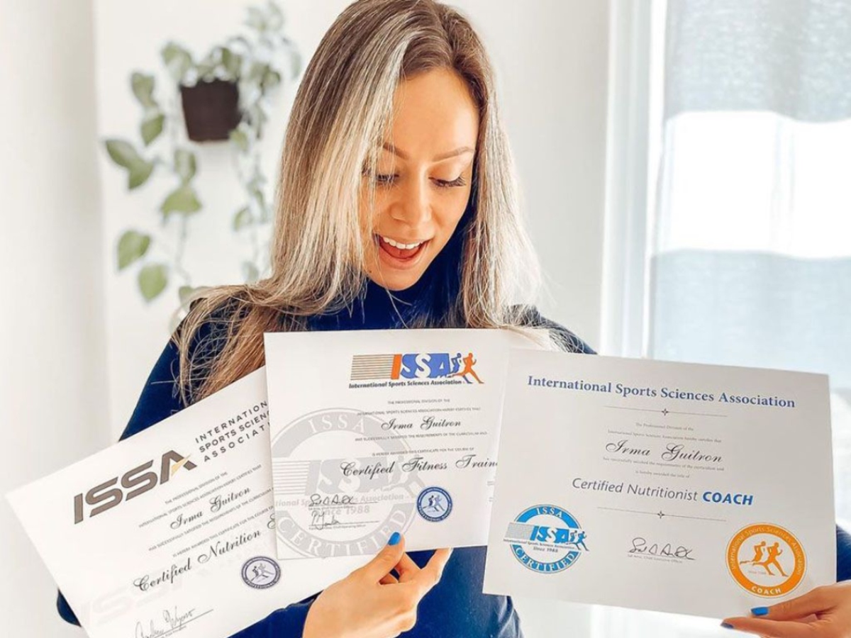 woman holding 3 certificates