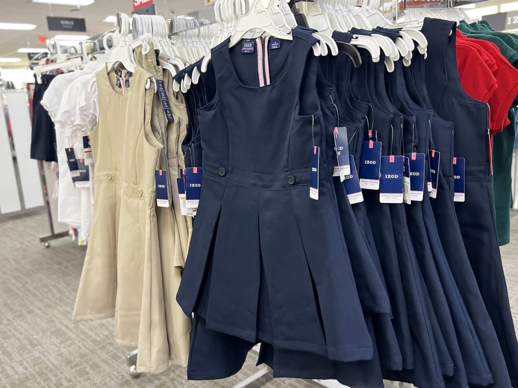 store display of girls uniform dresses