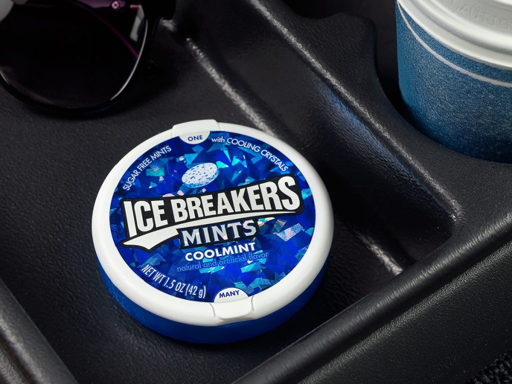 small tin of breath mints in car console