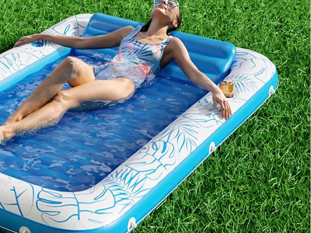 woman laying in pool float