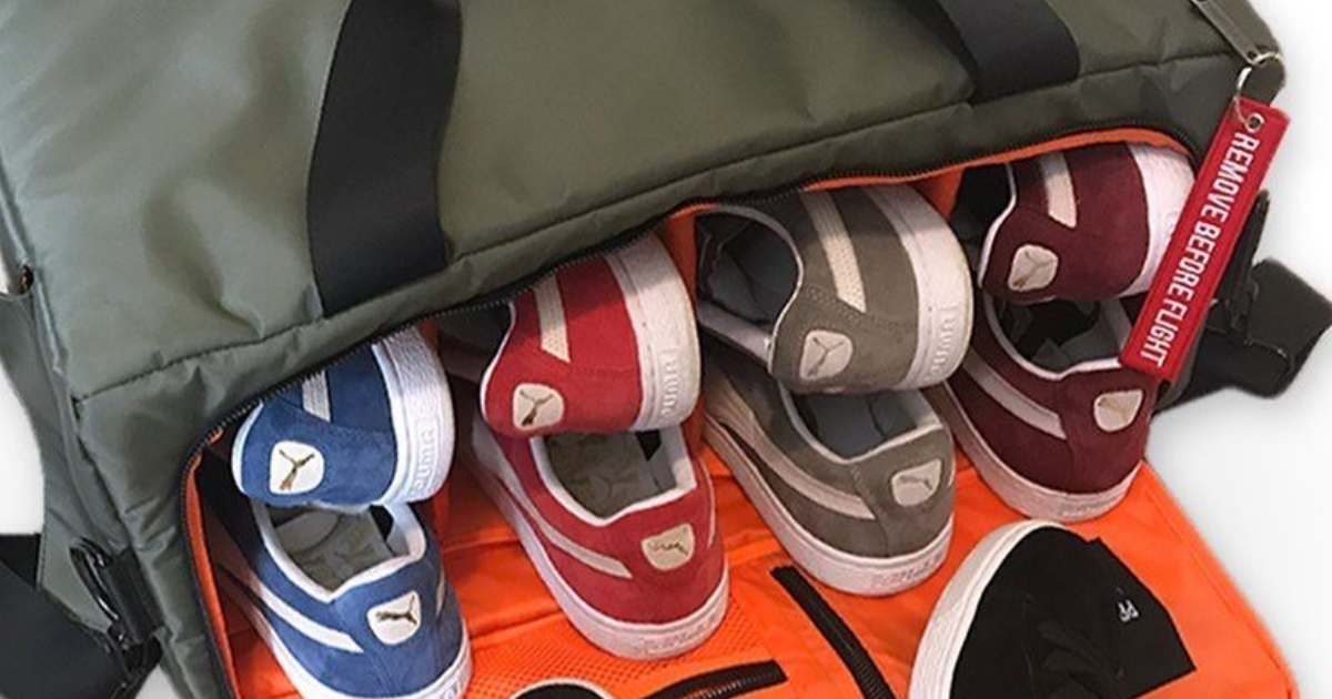 PUMA shoes stacked up in a bag