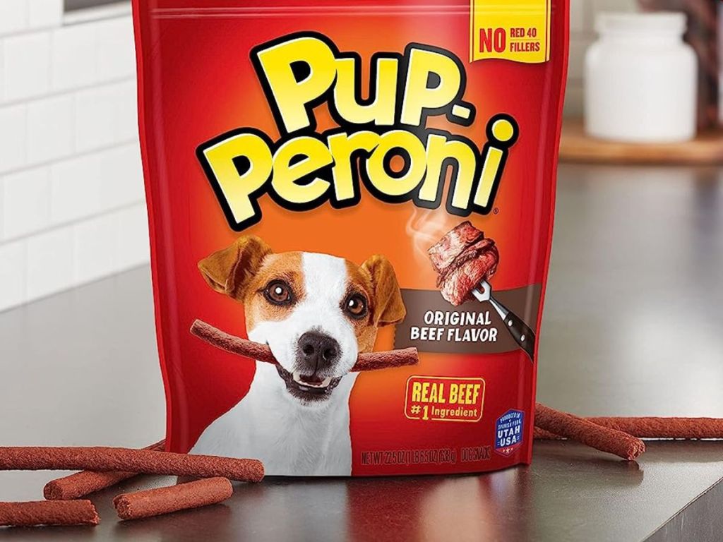 A bag of Pup-peroni Sticks treats on a stainless steel counter top