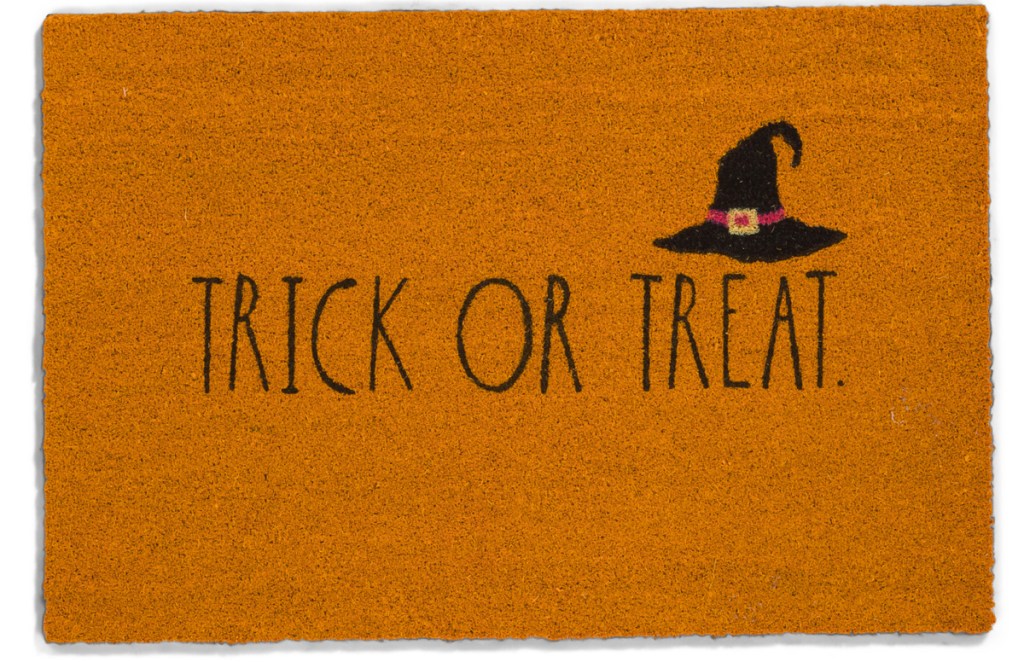 orange doormat that says trick or treat