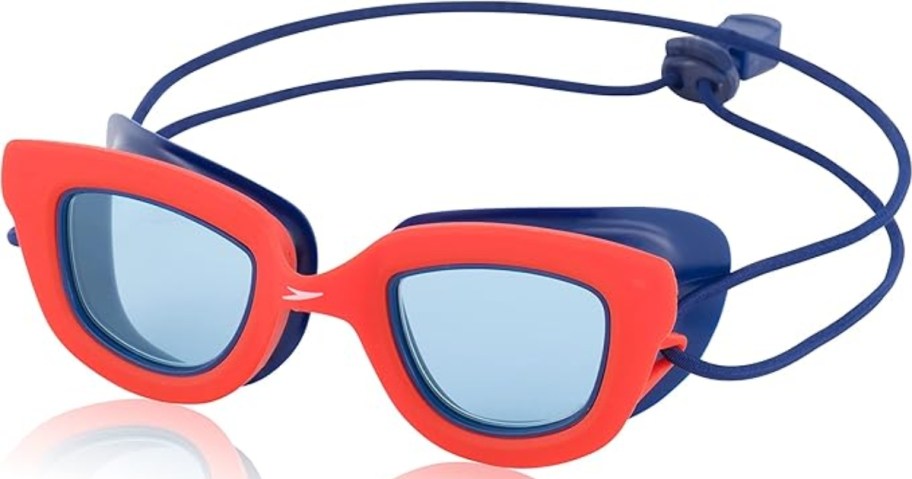 a pair of orange and blue kids swim goggles