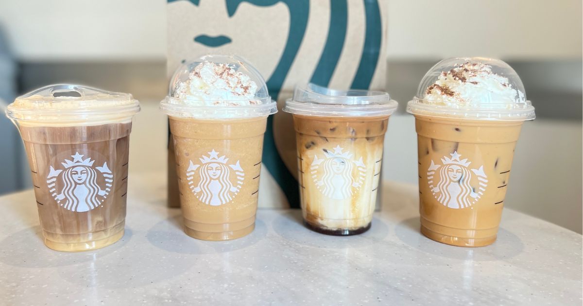 row of Starbucks drinks on a table