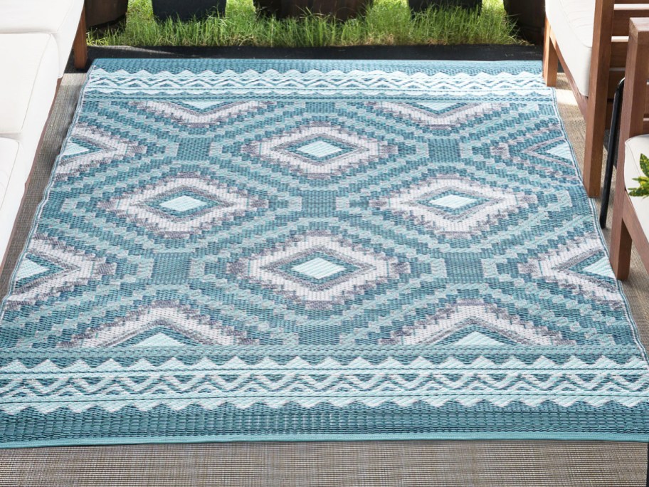 blue and white geometric outdoor area rug