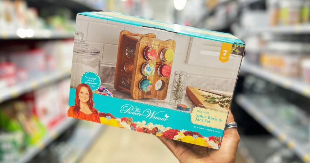 hand holding The Pioneer Woman spice rack set in store