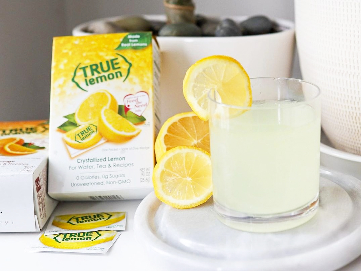true lemon box next to glass of lemonade 