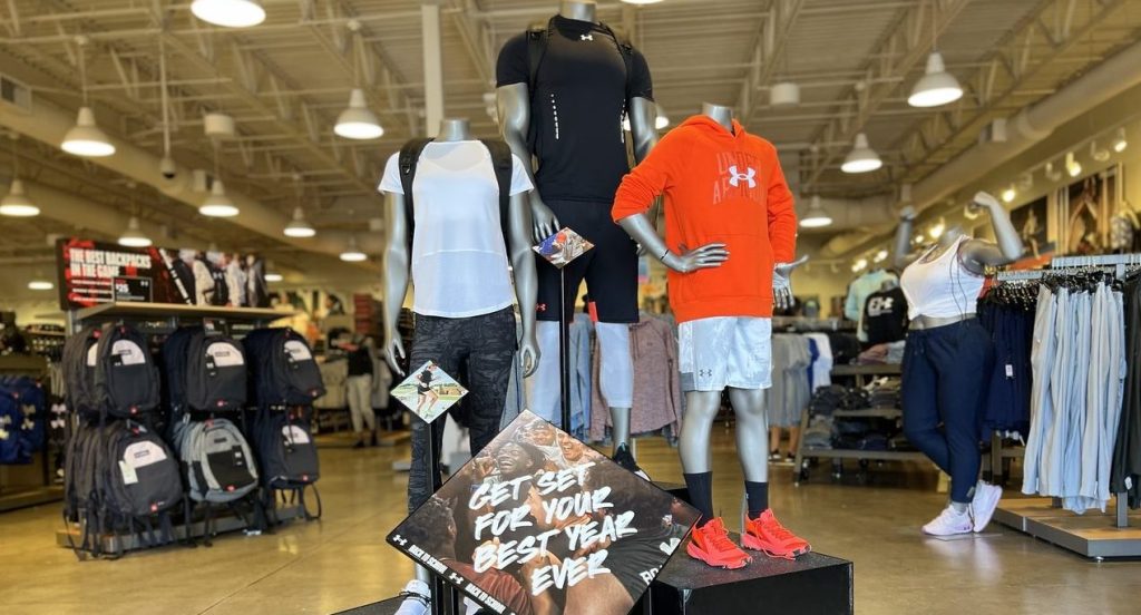 Under Armour mannequins with clothing in store