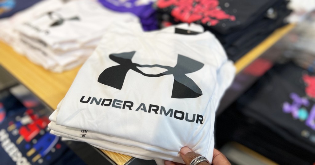 white and black folded under armour tee