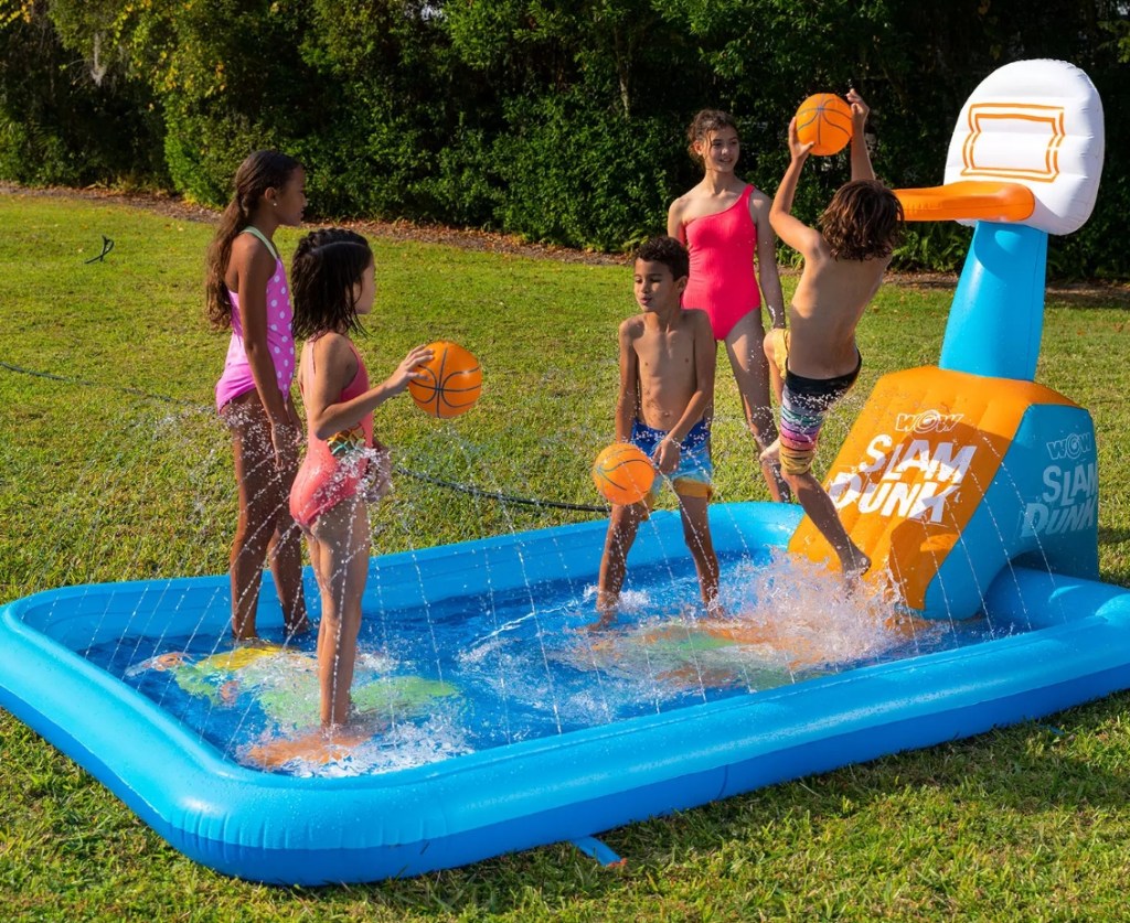 kids playing on an inflatable splash pad