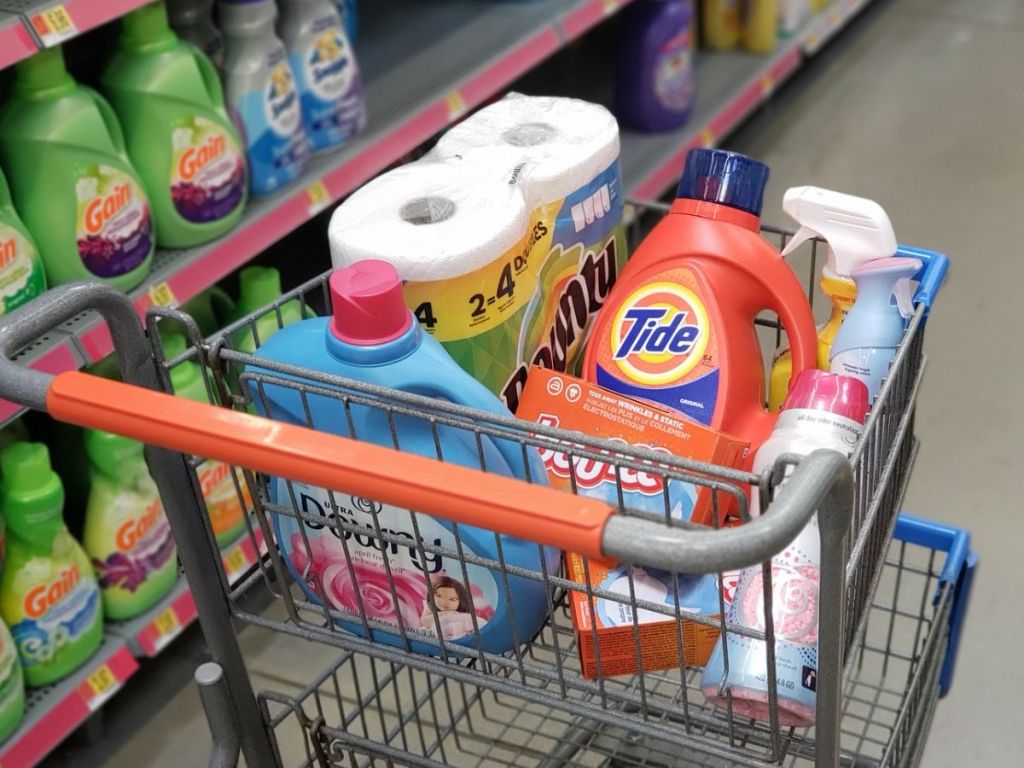 small shopping cart filled with household items at Walmart