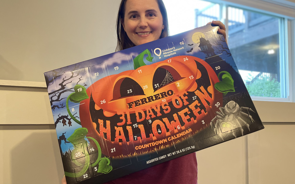 Woman holding Halloween calendar