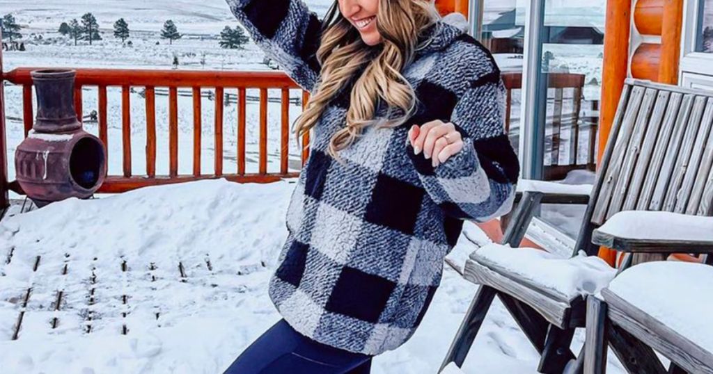 a model wearing a Women’s Plaid Sherpa Fleece Zip Sweatshirt in blue