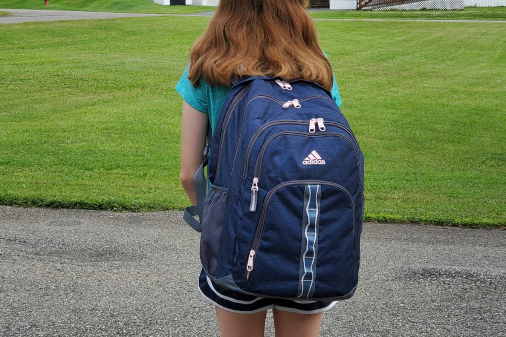 girl with navy backpack