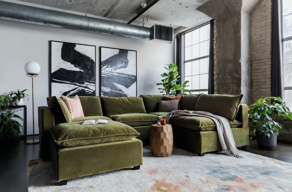 large green velvet couch sectional in industrial living room